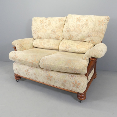 2583 - A mid-century mahogany and upholstered two-seater sofa, with label for Yeoman Upholstery. Overall 14... 