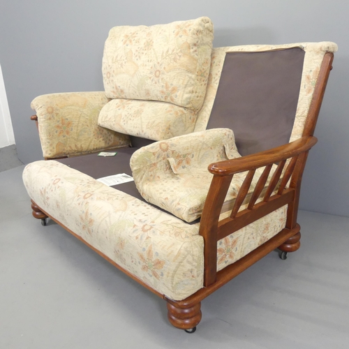 2583 - A mid-century mahogany and upholstered two-seater sofa, with label for Yeoman Upholstery. Overall 14... 