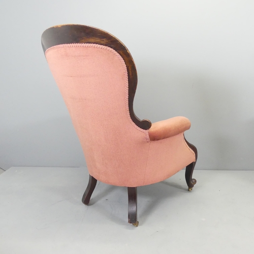 2585 - A Victorian mahogany and button-back upholstered spoon back armchair.