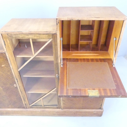 2586 - An Art Deco teak and oak veneered drinks cabinet of stepped form, with four compartments behind one ... 