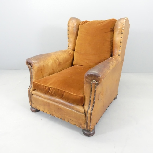 2588 - An antique French studded leather upholstered club armchair. Overall 80x90x90cm, seat 46x37x50cm.