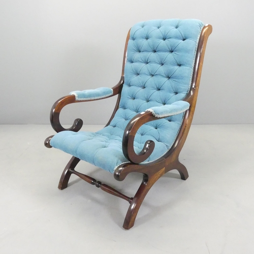 2589 - A mahogany and button-back upholstered William IV style open arm chair, with x-frame and turned stre... 