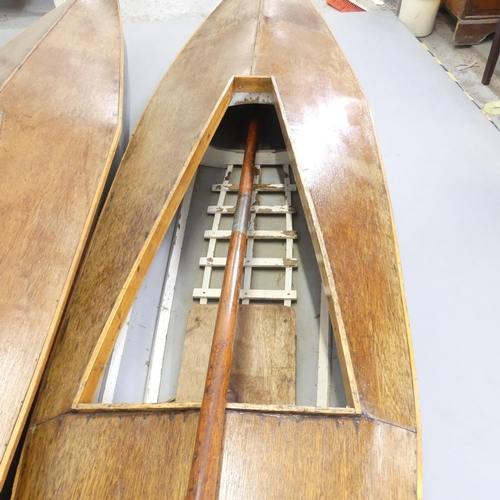 2594 - A pair of 1960s canvas on wooden framed kayak with teak decks. Length 335cm.