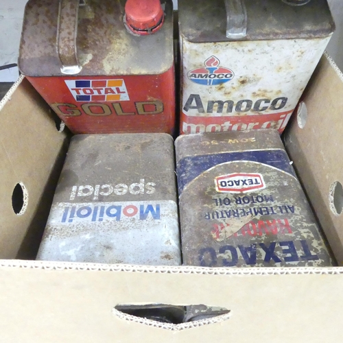 2602 - Eight various vintage petrol cans, including Esso, Mobil, BP, Amoco etc.