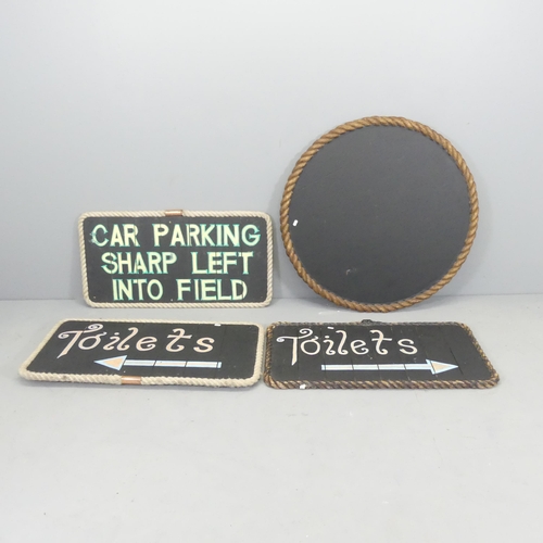 2620 - Four various black painted signs with rope surrounds. Diameter of circular sign 88cm.