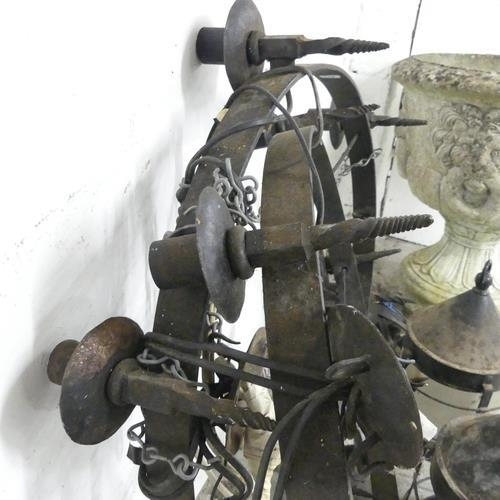 2621 - A pair of cast iron circular electric candelabra, diameter 63cm, and three hanging lanterns, 33x40cm... 