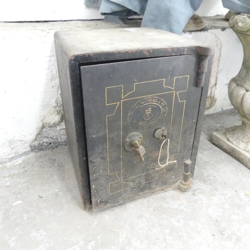 2627 - An antique painted metal floor safe, by Samuel Withers and co, West Bromwich. 42x51x41cm. With key. ... 