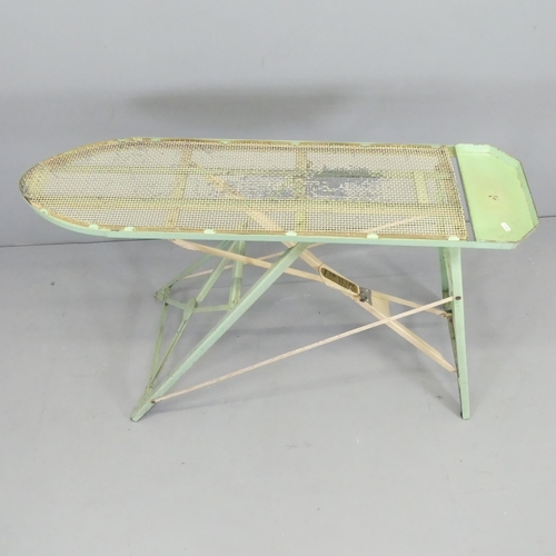 2629 - A mid-century ironing board, with paper label for Fab-Ware, by PTP ltd. 120x79x47cm.