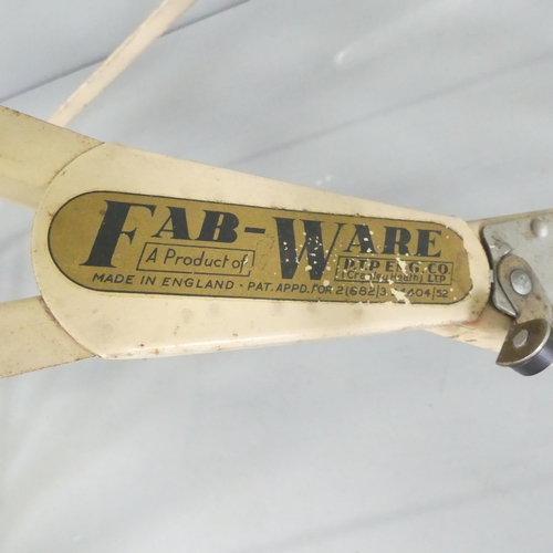 2629 - A mid-century ironing board, with paper label for Fab-Ware, by PTP ltd. 120x79x47cm.