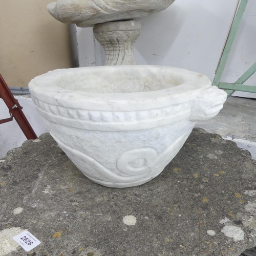 2632 - A marble basin/font with carved snake and dog decoration. 38x19cm.