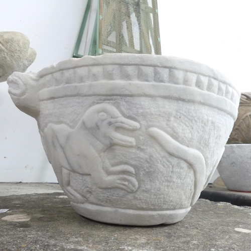 2632 - A marble basin/font with carved snake and dog decoration. 38x19cm.