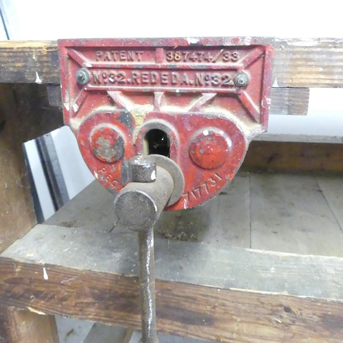 2649 - A vintage stained pine workbench, fitted with a No. 32 Rededa vice. 183x92x78cm.