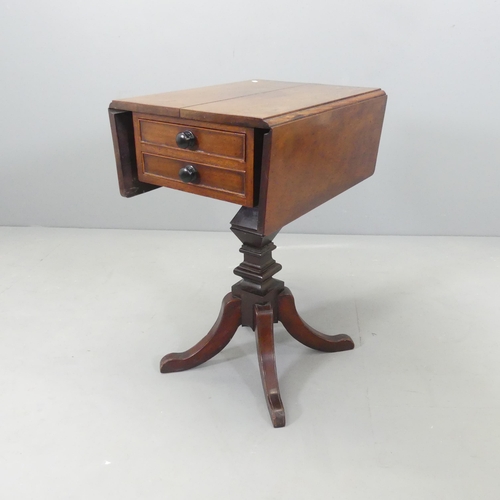 2655 - A Regency mahogany drop-leaf sewing table, with two drawers and raised on a square column with sabre... 