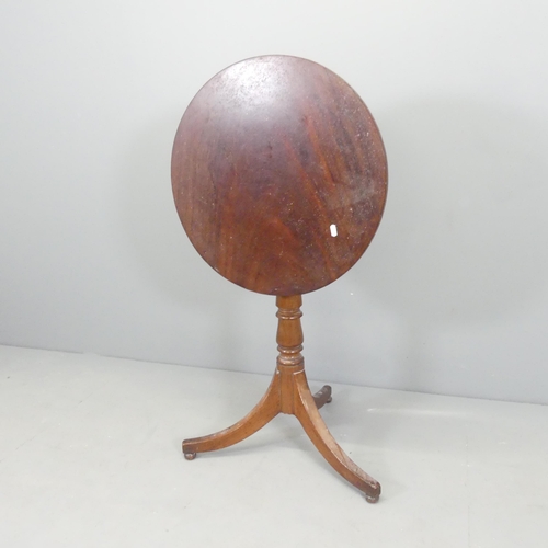 2656 - A 19th century mahogany circular tilt-top occasional table, on turned central column with tripod bas... 