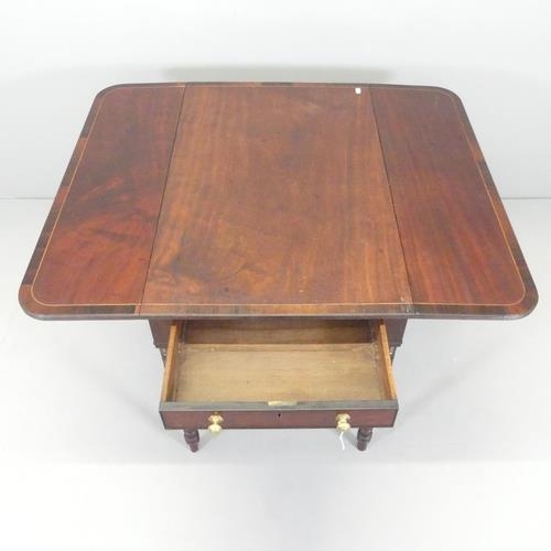 2661 - An antique mahogany Pembroke table, with end frieze drawer and raised on turned legs. 87x67x53cm (ex... 