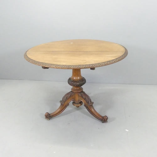 2683 - A 19th century Art Nouveau mahogany circular tilt-top occasional table, with carved decoration, cent... 