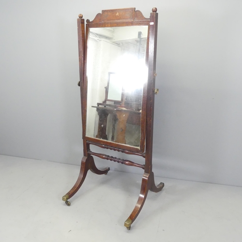 2685 - A 19th century mahogany cheval mirror, with ebony inlaid decoration. 69x153x64cm.