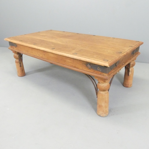 2693 - A modern sheesham and metal bound coffee table. 109x40x60cm.