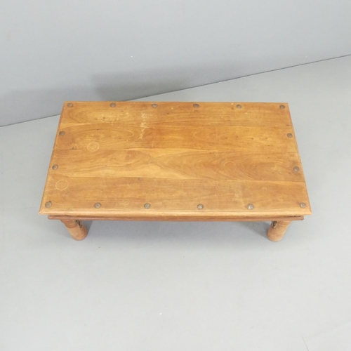 2693 - A modern sheesham and metal bound coffee table. 109x40x60cm.