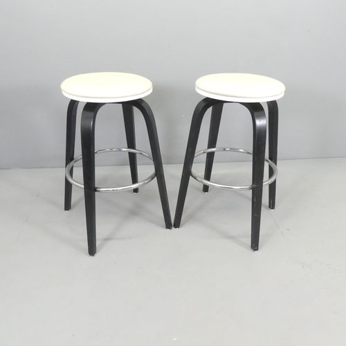 2694 - A pair of contemporary ebonised and faux leather upholstered bar stools, with chrome stretcher. Over... 