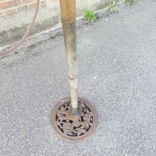 2696 - A Garden parasol on cast iron base. Diameter approximately 275cm, height 235cm.