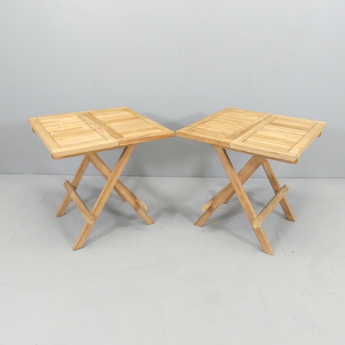 2700 - A modern pair of small teak folding garden tables. 50x50x50cm.