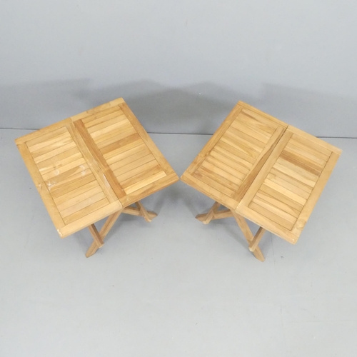 2700 - A modern pair of small teak folding garden tables. 50x50x50cm.