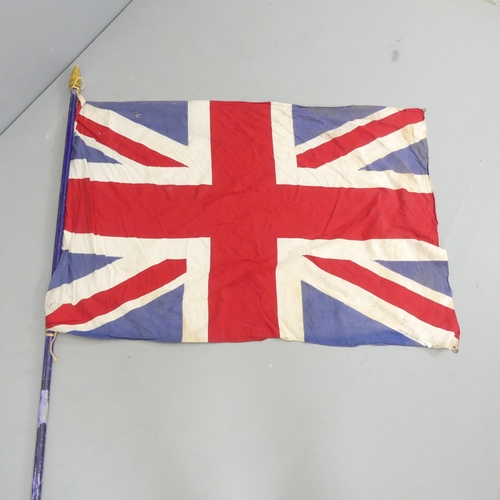 2703 - A vintage sewn Union Flag on pole. 135x96cm, pole length 230cm.