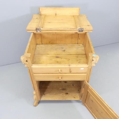 2704 - A continental pine washstand, with lifting top, single drawer and cupboard under. 66x80x48cm.