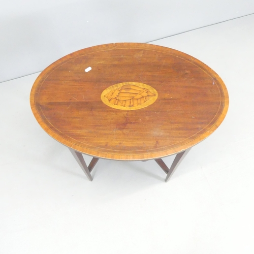 2708 - A Victorian mahogany and satinwood strung two-tier oval topped occasional table, with inlaid shell d... 