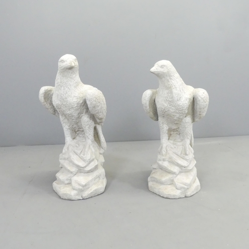 2715 - A pair of modern composite garden statues, studies of Eagles. Height 60cm.