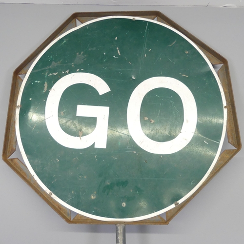 2721 - A metal framed Stop/Go road sign, Diameter 64cm, Height overall 210cm