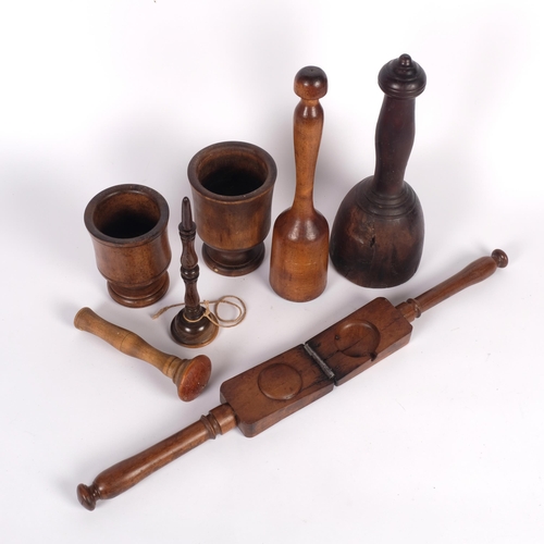 518 - A group of Antique treen items, to include 2 pestles/masher, and 2 mortars, a ball and cup stick (no... 