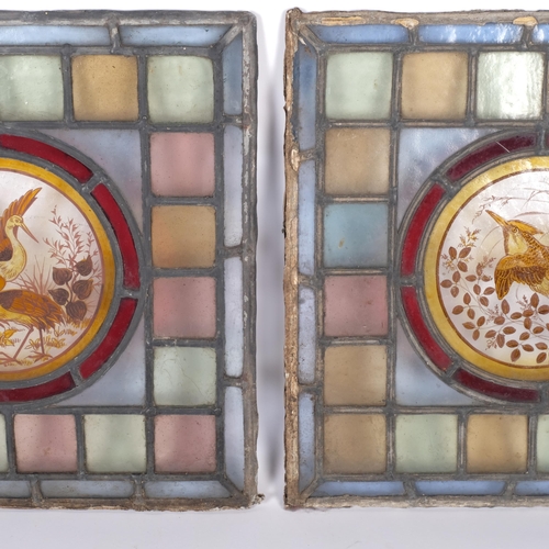524 - A pair of Victorian stained leadlight glass panels, with central hand painted bird decoration, 33.5c... 