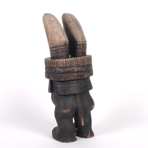 533 - A carved African hardwood Tribal figure, H36cm