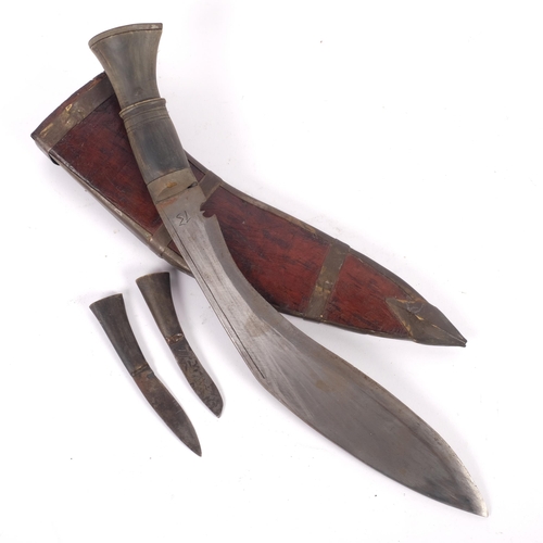 559 - An Indian kukri knife, with steel-bound leather scabbard, L40cm