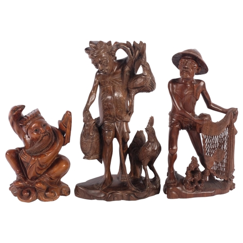 569 - A carved hardwood figure of a fisherman, a carved figure of a Chinese warrior, and another (3), tall... 