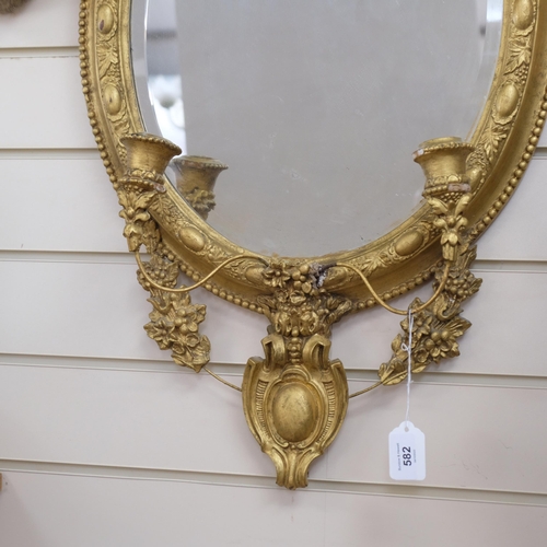 582 - A 19th century giltwood girondole mirror, with candle sconces, L70cm, Width 44cm