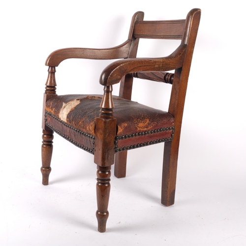 589 - A 19th century child's mahogany elbow chair with studded leather seat