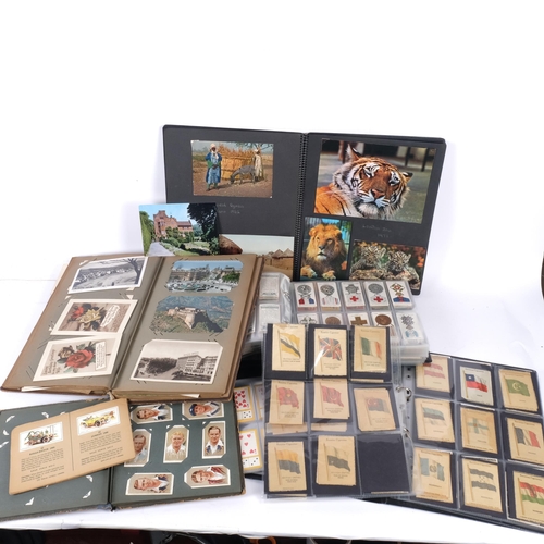 611 - An album of John Player, Brooke Bond, and Carreras Ltd tea cards, titles including Britain's Defence... 