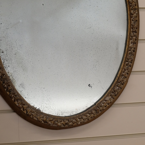 616 - 19th century giltwood and gesso oval wall mirror, H65cm