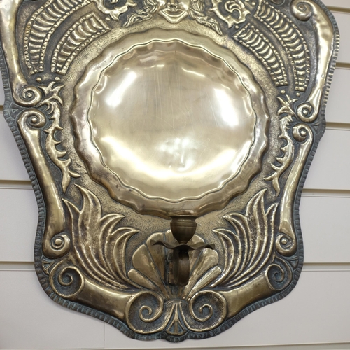 617 - An Antique Dutch  brass shield-back wall sconce, stylised repousse decoration, L57cm