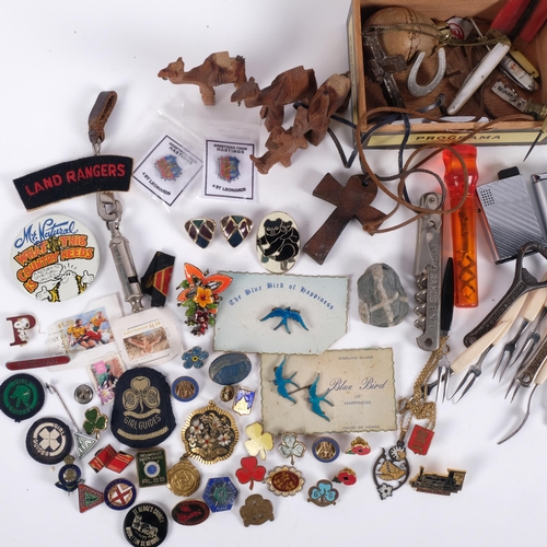 636 - A collection of various bottle openers, corkscrews, whistle, brooches etc