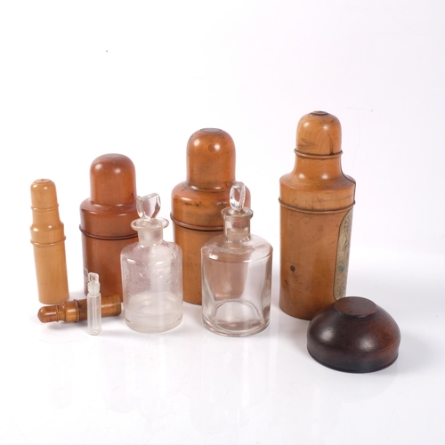 652 - A group of Vintage treen items, including 3 bottle and stopper holders, needle case etc