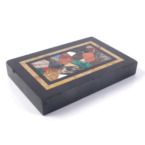 691 - A Grand Tour black marble and Pietra Dura desk paperweight of rectangular form, 13.5 x 9cm