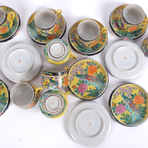 725 - A set of 12 x 20th century eggshell cups and saucers, with hand painted enamelled floral decoration