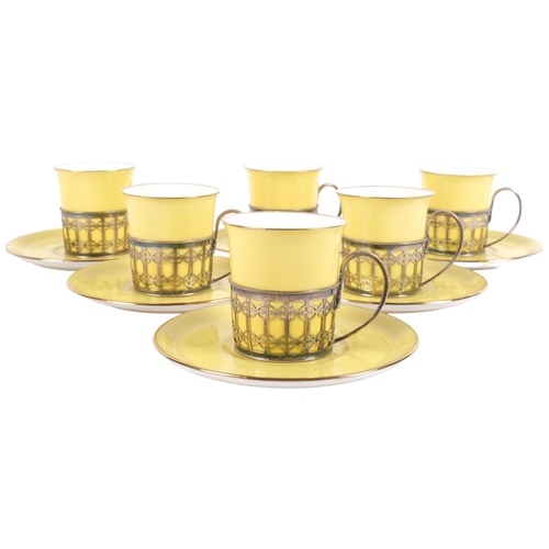 882 - A set of 6 Shelley porcelain cans and saucers, in silver holders, H5.5cm