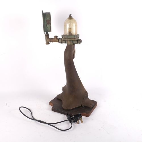 889 - A wall bracket on oak plinth converted to a novelty table lamp, H53cm