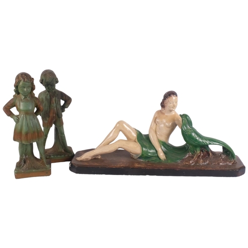 894 - A pair of Vintage plaster children, 30cm, and an Art Deco painted plaster lady with pheasant