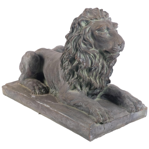 896 - A terracotta lion sculpture on plinth, with verdigris finish, L39cm overall